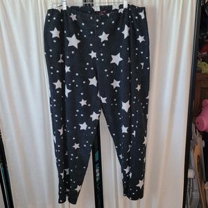 Women's size medium black pajama pants with stars, fair condition